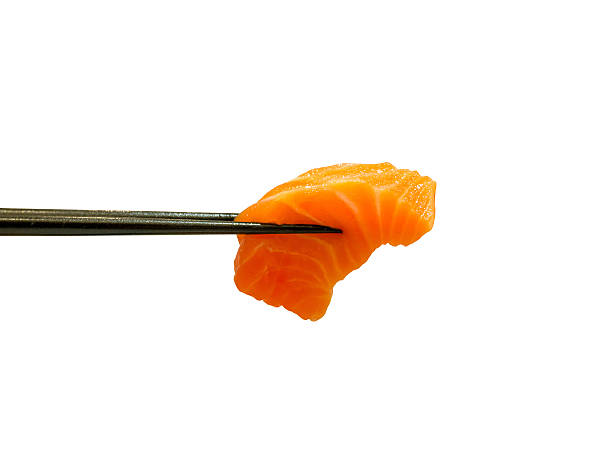 istock red salmon fish slice sashimi in chopsticks 583735268