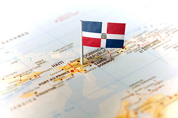 Dominican Republic pinned on the map with flag The flag of Dominican Republic pinned on the map. Horizontal orientation. Macro photography. dominican republic map stock pictures, royalty-free photos & images