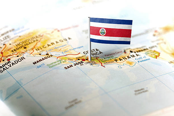 The flag of Costa Rica pinned on the map. Horizontal orientation. Macro photography.