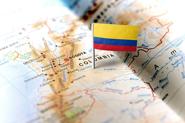 Colombia pinned on the map with flag The flag of Colombia pinned on the map. Horizontal orientation. Macro photography. colombia photos stock pictures, royalty-free photos & images