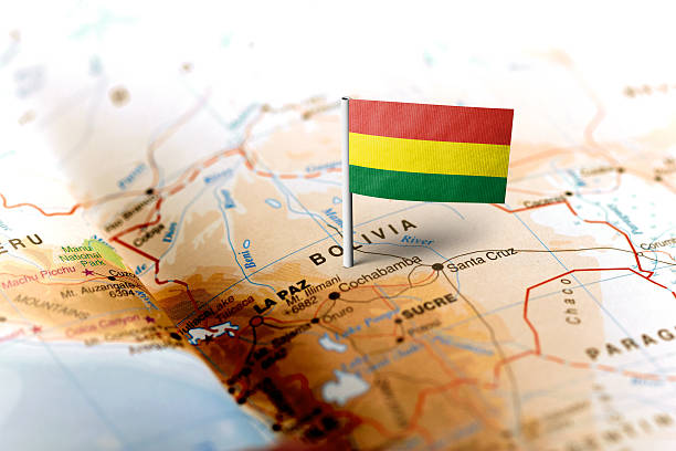 Bolivia pinned on the map with flag The flag of Bolivia pinned on the map. Horizontal orientation. Macro photography. bolivia photos stock pictures, royalty-free photos & images