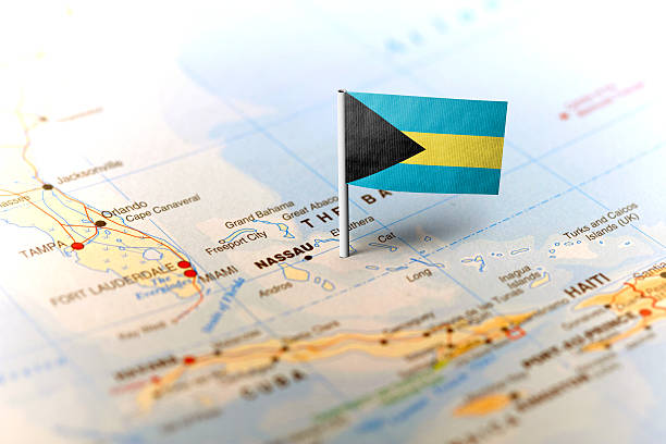 Bahamas pinned on the map with flag The flag of Bahamas pinned on the map. Horizontal orientation. Macro photography. bahamas map stock pictures, royalty-free photos & images