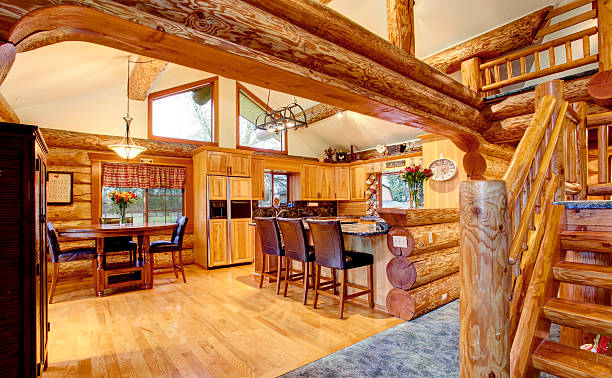 istock Log cabin house interior of dining and kitchen room 583795328