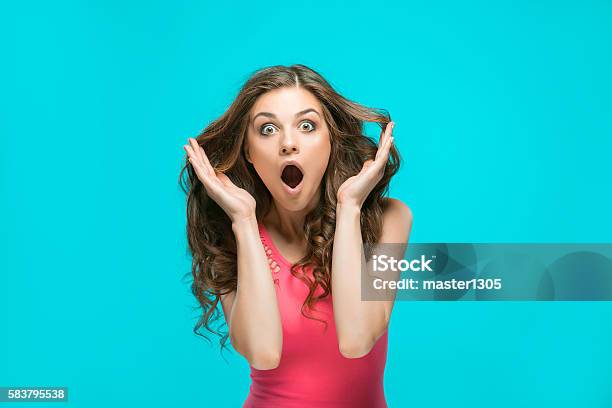 Portrait Of Young Woman With Shocked Facial Expression Stock Photo - Download Image Now