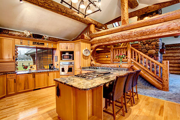 istock Log cabin kitchen interior design with honey color cabinets. 583795590