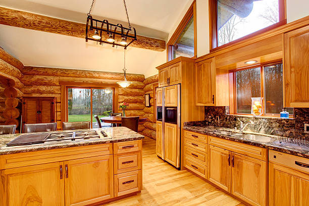 istock Log cabin kitchen interior design with honey color cabinets. 583795712