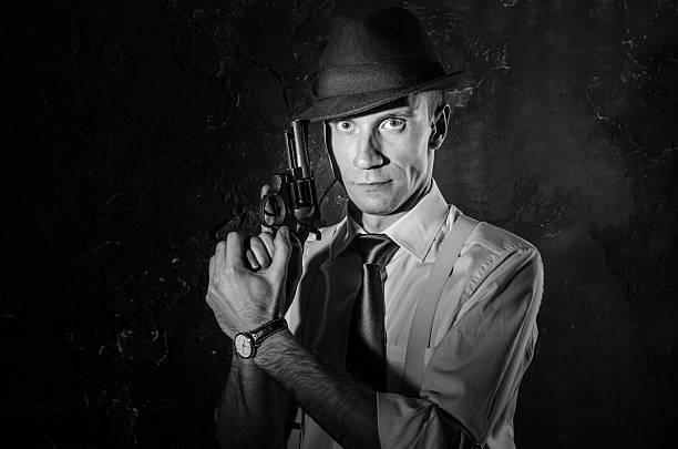 Gangster with tommy gun. Film noir style.