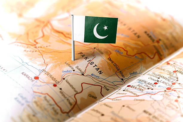 The flag of Pakistan pinned on the map. Horizontal orientation. Macro photography.