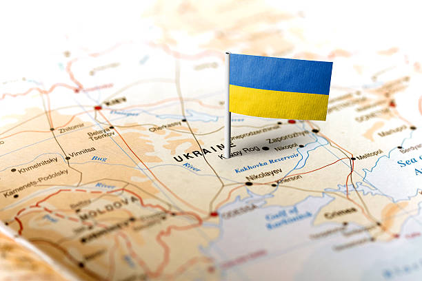 Ukraine pinned on the map with flag The flag of Ukraine pinned on the map. Horizontal orientation. Macro photography. ukraine stock pictures, royalty-free photos & images