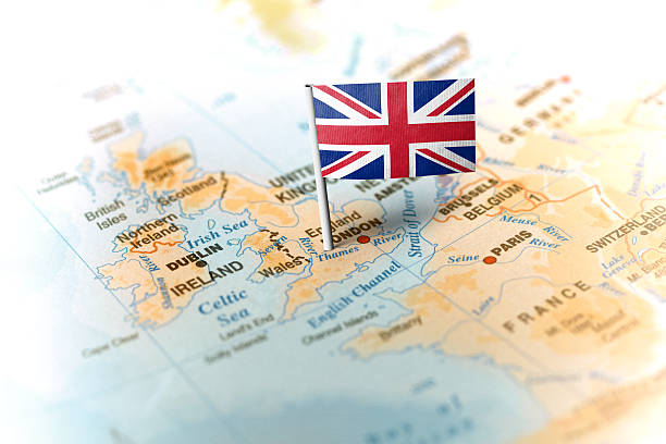 istock United Kingdom pinned on the map with flag 583798574