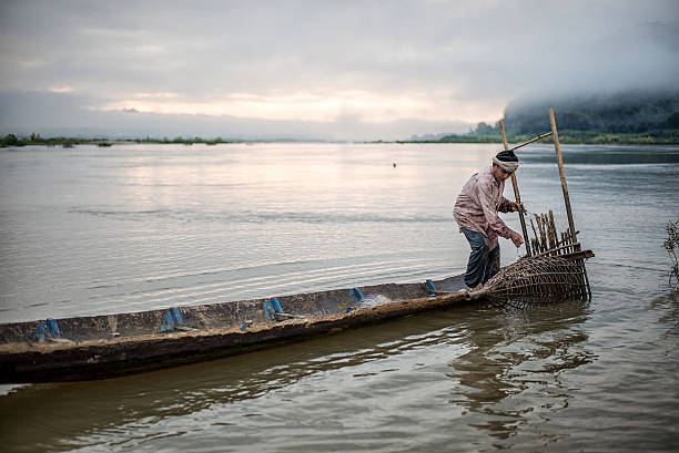 istock Fisherman on boat in action when fishing 583798696