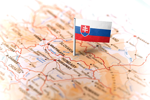 The flag of Slovakia pinned on the map. Horizontal orientation. Macro photography.