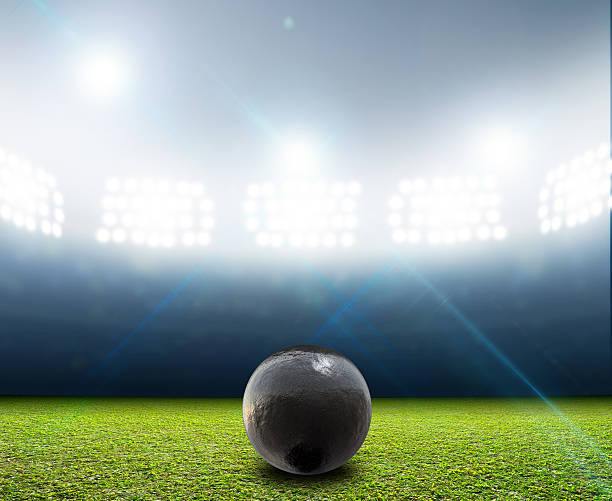 istock Shotput Ball In Generic Floodlit Stadium 583799380