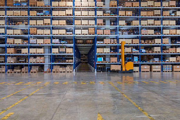 istock Forklift carrying cardboard box in warehouse. 583802174