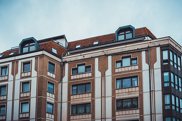 istock orange facade of an apartment building 583803096