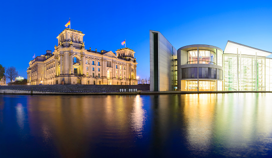 The Reichstag Parliament and River Spree in Berlin at twilight, Germany.
