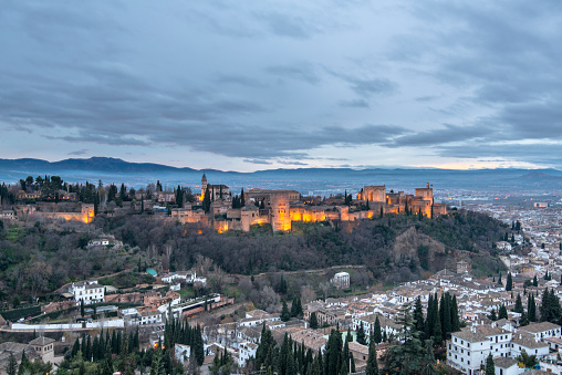 Ancient arabic fortress of Alhambra palace at dusk in Granada. Andalusia, Spain