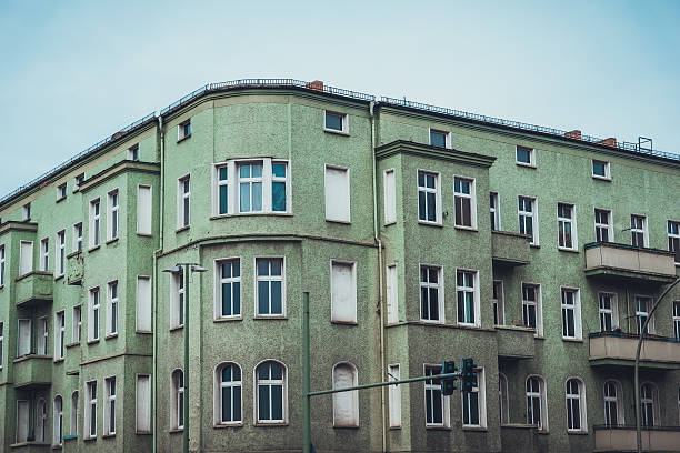 istock Apartments with curved corner and green exterior 583806454