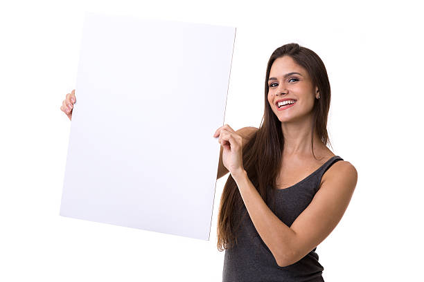 istock Young woman holding whiteboard on white background 583809840