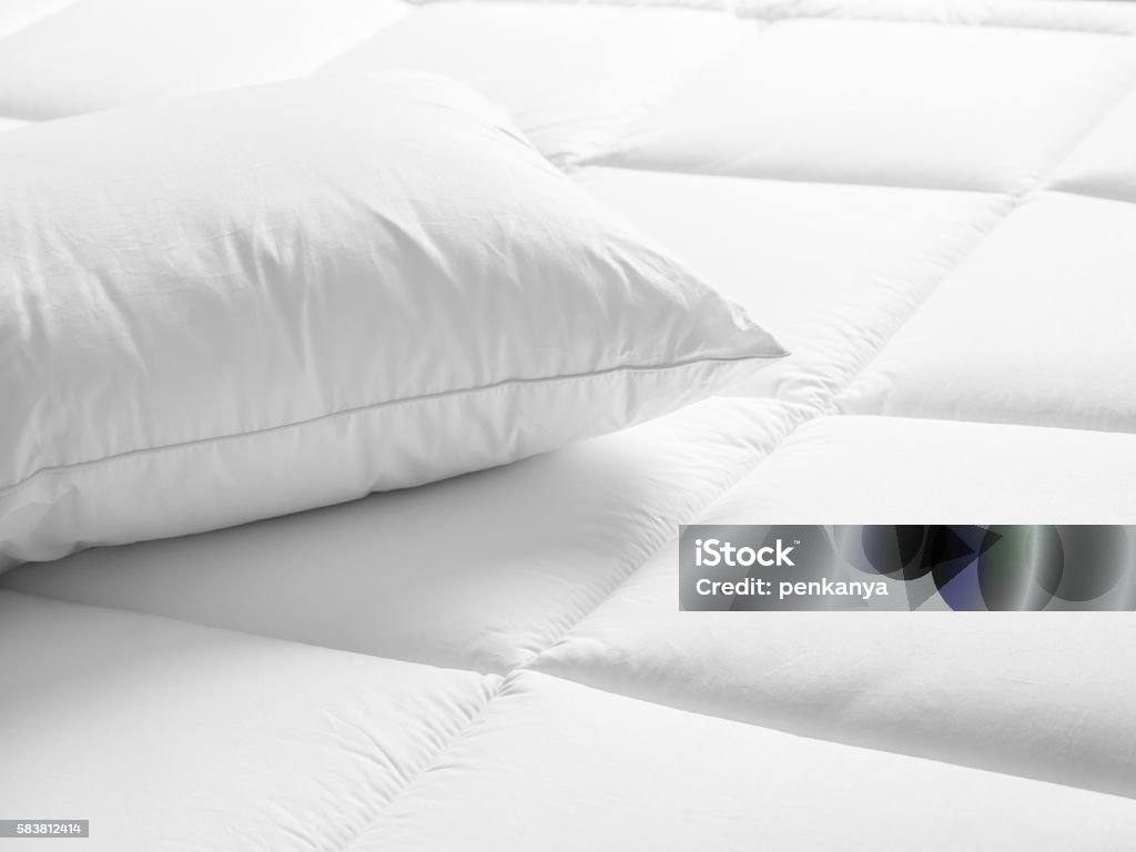 Closeup of white pillow on the bed in the bedroom Mattress Stock Photo