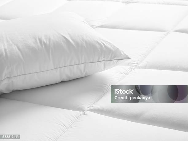 Closeup Of White Pillow On The Bed In The Bedroom Stock Photo - Download Image Now - Mattress, Duvet, White Color