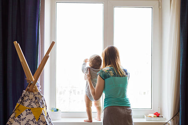 istock young mother with a charming baby 583814786