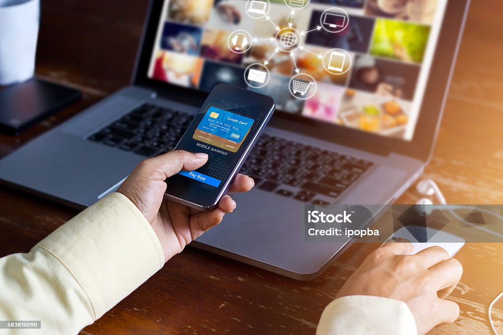 Man using mobile payments online shopping and icon customer network Man using mobile payments online shopping and icon customer network connection on screen, m-banking and omni channel Security Stock Photo