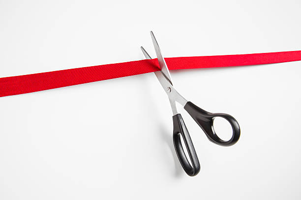 cutting a red ribbon - beginnings business new business ribbon fotografías e imágenes de stock