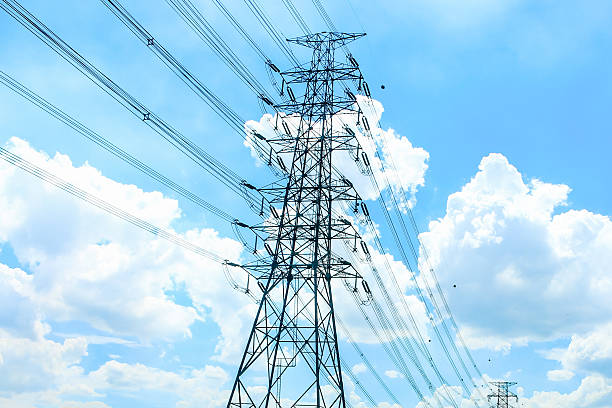 istock giant electricity post on blue sky background 583817924