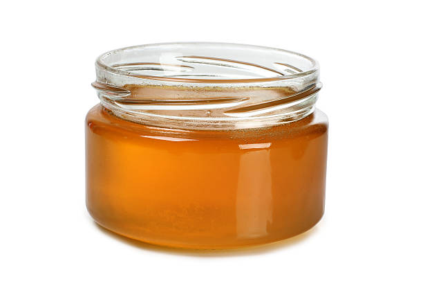 istock Honey in glass 583819444