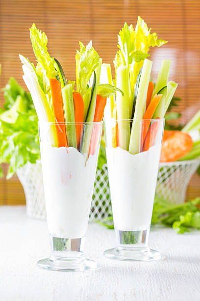 istock Two glasses of assorted fresh vegetables with yogurt 583821390