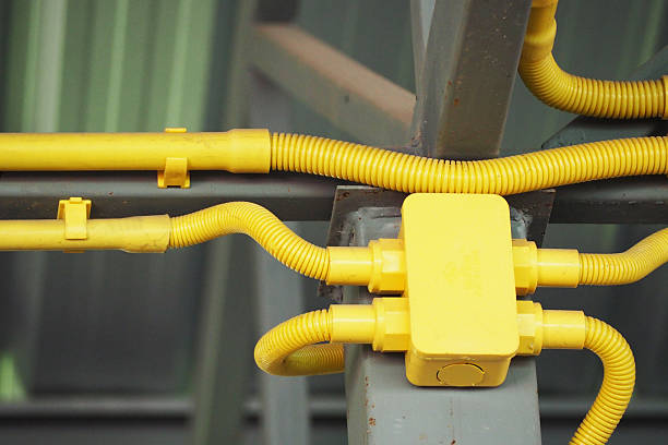 istock Pipe of electricity line on ceiling 583825202