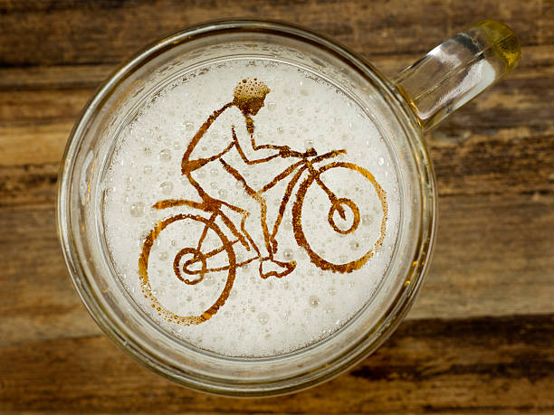 cyclist in beer foam stock photo