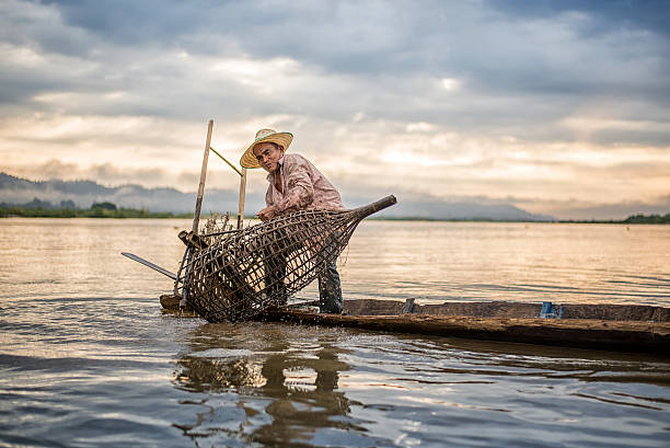 istock Fisherman on boat in action when fishing 583828742