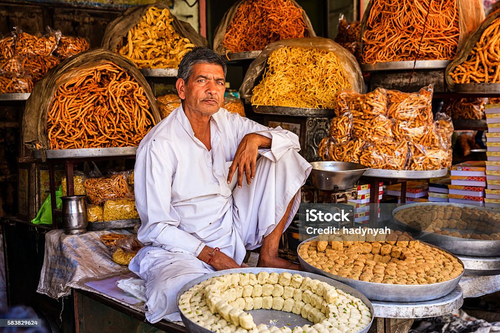 Indian street vendor selling sweets near Jaipur, India Indian street vendor selling sweets near Jaipur. Jaipur is the capital city of Rajasthan. Jaipur is known as the Pink City, because of the color of the stone exclusively used for the construction of all the structures. India Stock Photo