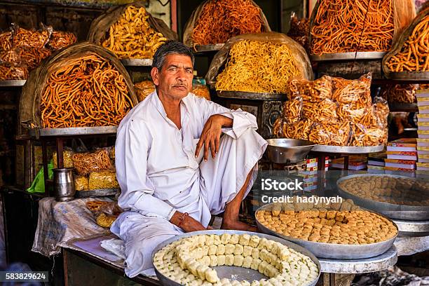 Indian Street Vendor Selling Sweets Near Jaipur India Stock Photo - Download Image Now