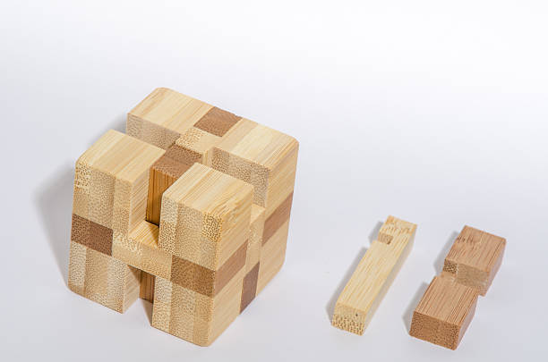 istock Complex Wooden Puzzle Partially Disassembled 583829670