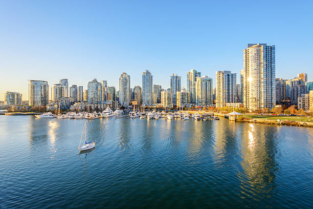 Downtown skyline in Vancouver, Canada. View from the Cambie Bridge. Downtown skyline in Vancouver, Canada. false creek stock pictures, royalty-free photos & images