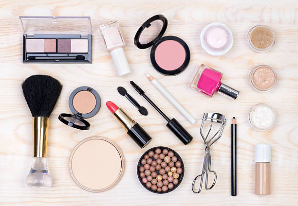 istock Makeup cosmetics on white, wooden background 583833476