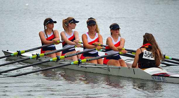 Close up of Female Scullers St Neots, Cambridgeshire, England - July 24, 2016: Close up of Newark Coxed four ladies sculling team in competition on the River Ouse at St Neots. ouse river photos stock pictures, royalty-free photos & images
