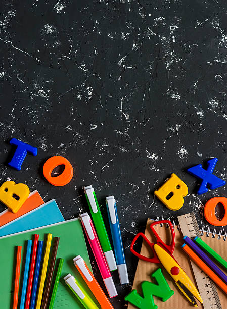 istock School accessories on a dark background. Top view 583837052
