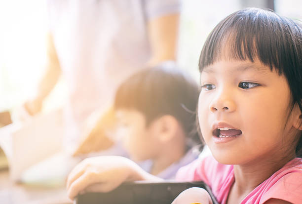 istock Japanese girl having fun in classroom 583839826