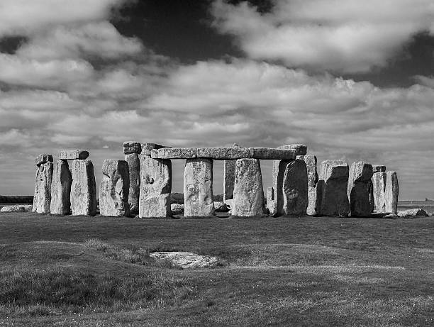 istock Stonehenge on Grass Field against Cloudy Sky 583841388