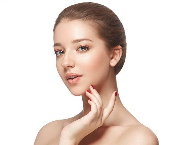 istock Beautiful woman face close up portrait young studio on white 583841802