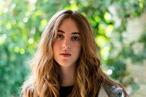 istock Long haired teenage girl facing the camera 583843214