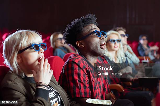 Young People In 3d Movie Theater Stock Photo - Download Image Now - Human Face, Black Color, Men