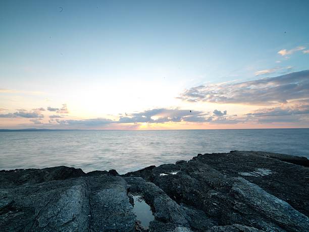 istock Long exposure shot on amazing rocks and sea waves 583846816