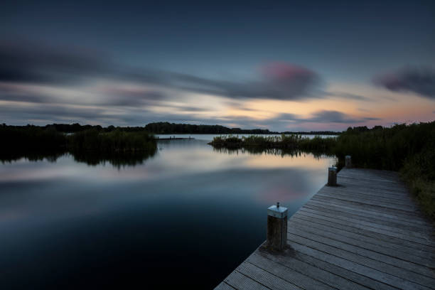 Low Key Sunset Lake In Long Exposure.