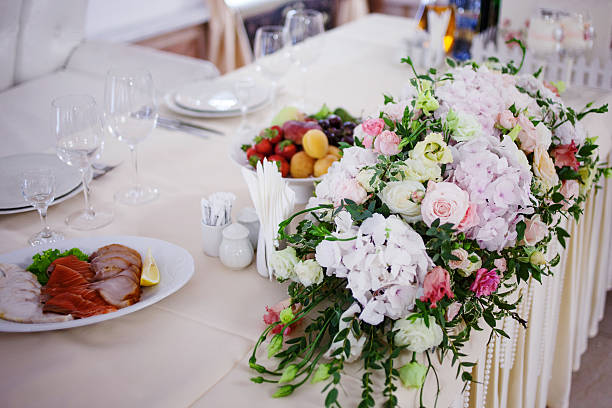 istock Serving wedding table flowers. Design Bureau for newlyweds 583847800