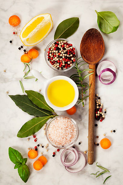 istock Wooden spoon and ingredients on marble background 583848518